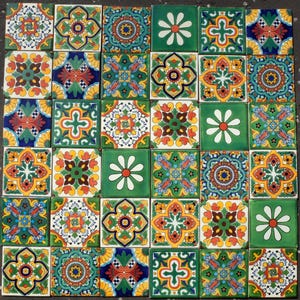May include: A collection of thirty-six square ceramic tiles arranged in a grid. The tiles feature a variety of intricate, colourful patterns in shades of green, yellow, red, blue, and white, including floral motifs and geometric designs.