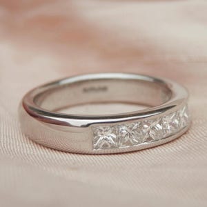 Vintage diamond eternity ring, 0.80ct princess cut diamonds, platinum hallmark London 1999, independent valuation, size K.5, US 5.5 sizeable