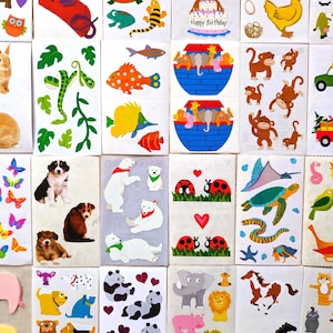 May include: A collection of rectangular sticker sheets featuring various colorful illustrations including animals like rabbits, dogs, monkeys, polar bears, elephants, and lions, along with fish, insects, birds, and a birthday cake with the text Happy Birthday.
