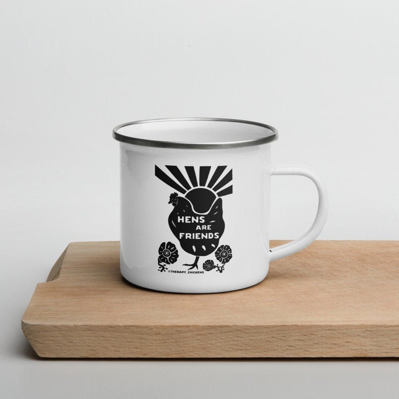 May include: White enamel mug with a black silhouette of a chicken and the text "Hens are Friends" and "Therapy Chickens".