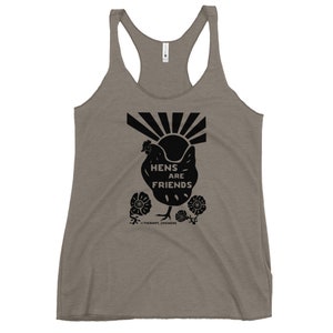 May include: A gray tank top with a black silhouette of a chicken with the text "Hens are Friends" and a sunburst design. The text "Therapy Chickens" is below the chicken.