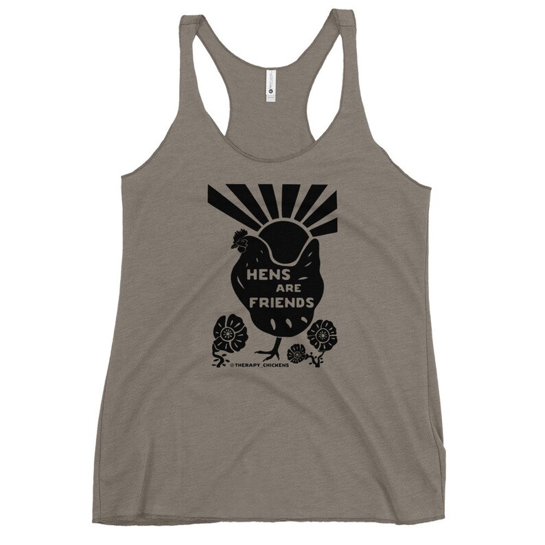 May include: A gray tank top with a black silhouette of a chicken with the text "Hens are Friends" and a sunburst design. The text "Therapy Chickens" is below the chicken.