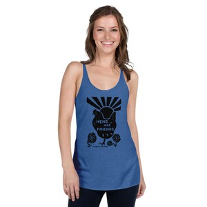 May include: A blue tank top with a black graphic of a chicken with the text "Hens are Friends" and a sun with rays behind it. The graphic also includes flowers.