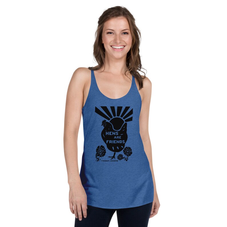 May include: A blue tank top with a black graphic of a chicken with the text "Hens are Friends" and a sun with rays behind it. The graphic also includes flowers.