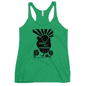 May include: Green tank top with a black silhouette of a chicken and the text "Hens are Friends" with a sunburst behind the chicken. The text "Therapy Chickens" is at the bottom of the design.