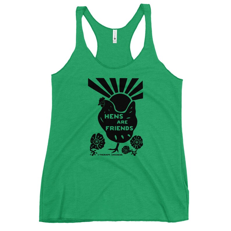 May include: Green tank top with a black silhouette of a chicken and the text "Hens are Friends" with a sunburst behind the chicken. The text "Therapy Chickens" is at the bottom of the design.