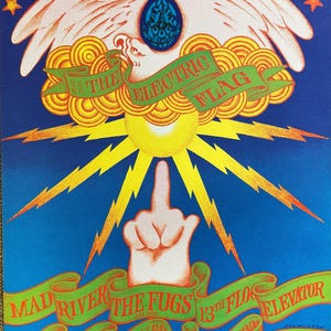 May include: A vintage concert poster with a psychedelic design featuring a white eagle with outstretched wings, a yellow sun with lightning bolts, and a hand giving the middle finger. The poster advertises a concert by Mad River and The Fugs at the Avalon Ballroom in San Francisco on February 23 and 24, 1967.