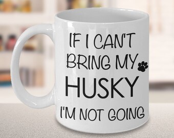 May include: White ceramic coffee mug with a black paw print and the text "If I can't bring my Husky I'm not going."