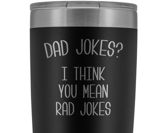 May include: Black stainless steel tumbler with a silver lid. The tumbler has a white inscription that reads "Dad Jokes? I think you mean Rad Jokes."