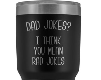 May include: Black stainless steel tumbler with a silver lid. The tumbler has the text "Dad Jokes? I think you mean Rad Jokes" printed on it.