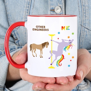 May include: White ceramic mug with a red handle. The mug has a graphic of a horse and a unicorn. The text on the mug reads "Other Engineers" and "Me".