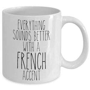 May include: White ceramic coffee mug with black text that reads "Everything sounds better with a French accent".