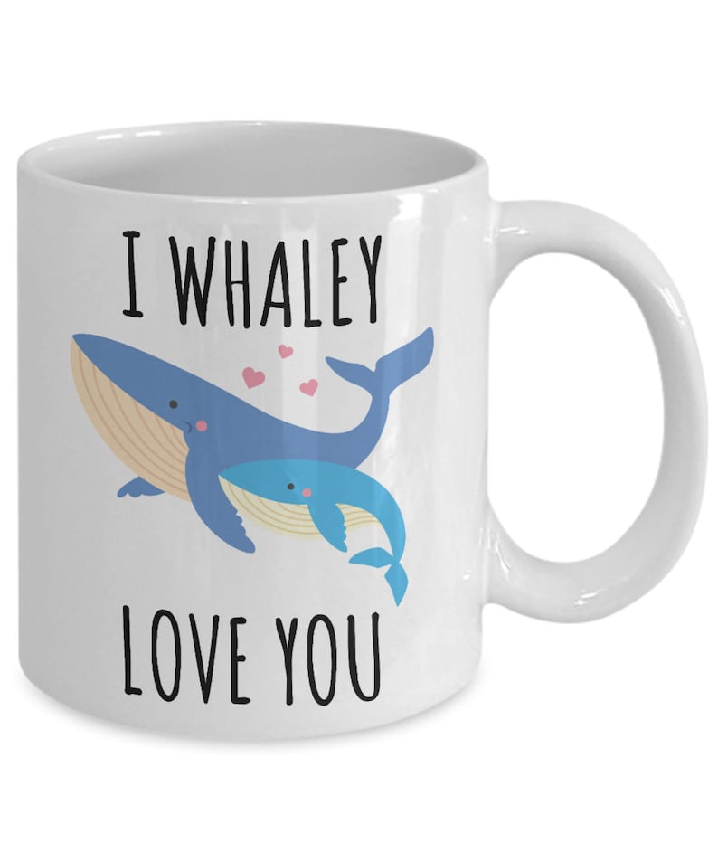 May include: White ceramic coffee mug with a blue whale and a baby whale illustration. The text "I whaley love you" is printed on the mug.