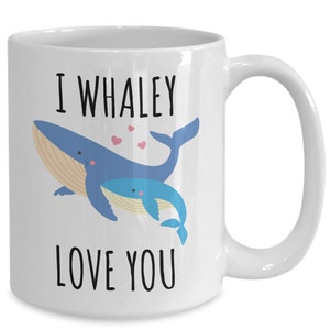 May include: White ceramic coffee mug with a blue whale and a baby whale illustration. The text "I whaley love you" is printed on the mug.