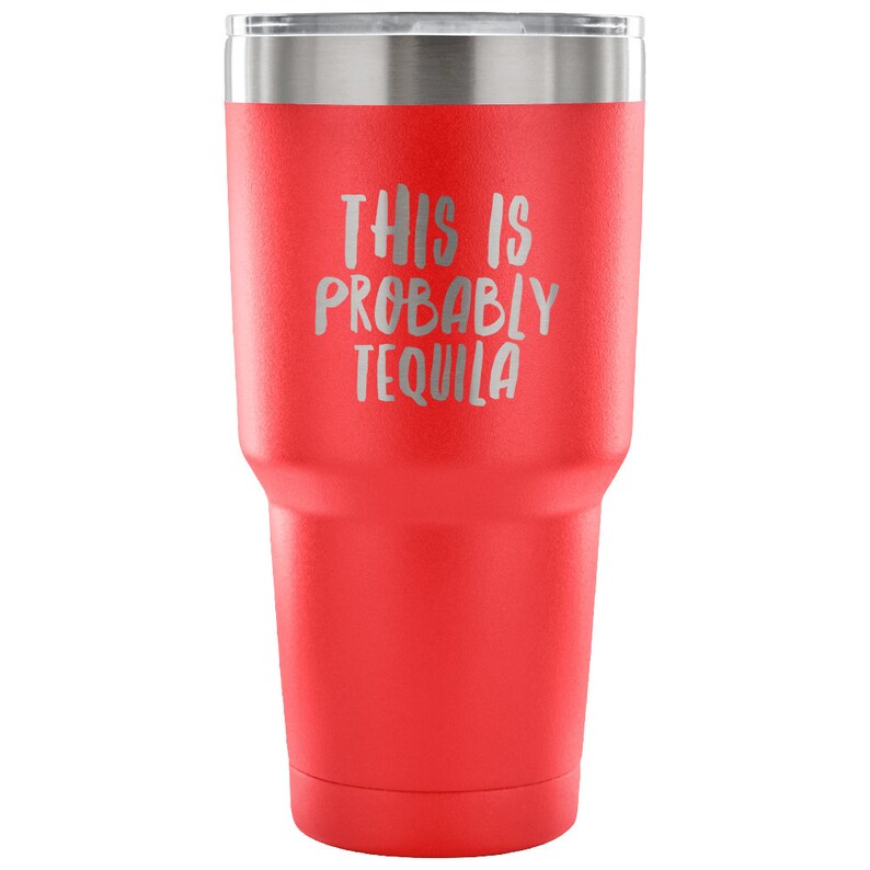 May include: Red stainless steel tumbler with a silver lid and the text "This is probably tequila" in silver lettering.