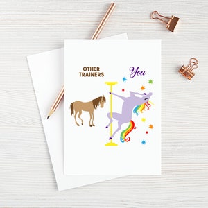 May include: A greeting card with a humorous illustration comparing other trainers to a unicorn. The text reads "Other Trainers" and "You". The unicorn is purple with a rainbow mane and tail, and is holding onto a pole. The other trainer is a brown horse.