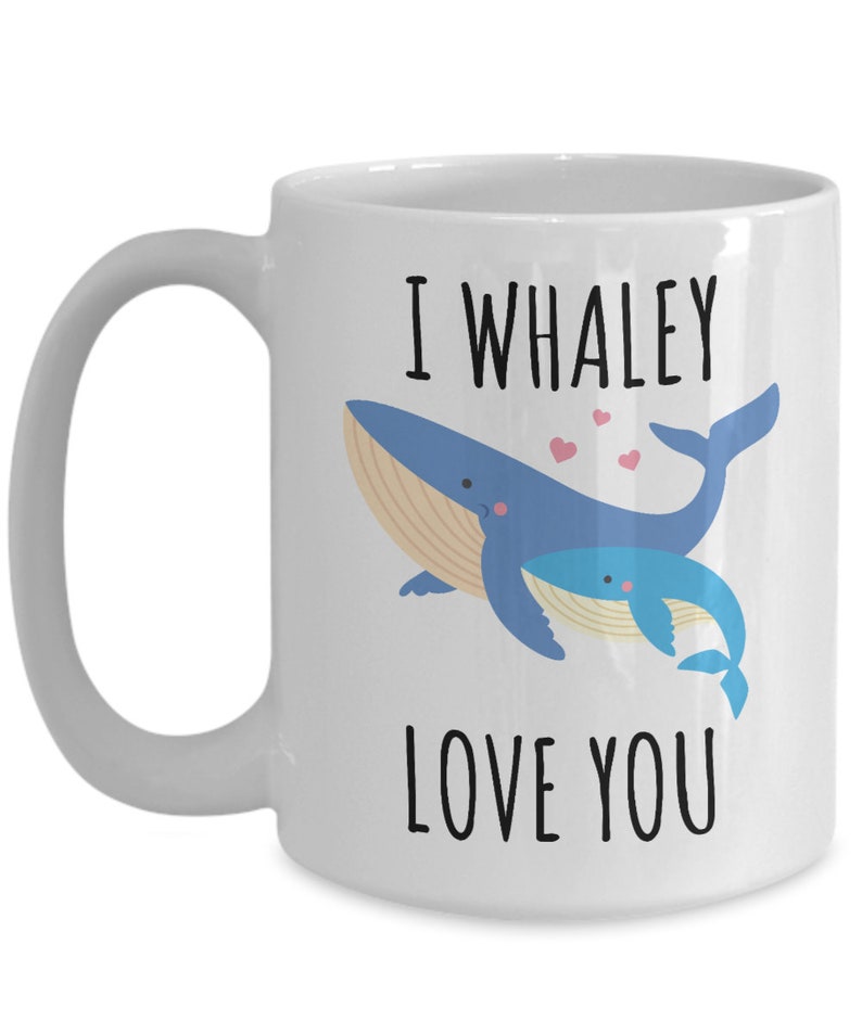 May include: White ceramic coffee mug with a blue whale and a baby whale illustration. The text "I whaley love you" is printed on the mug.