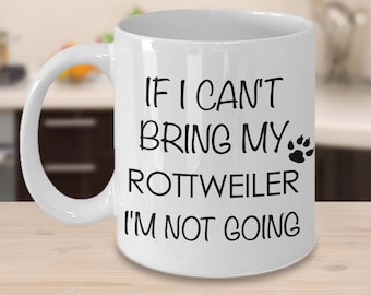 May include: White ceramic coffee mug with black text that reads "If I can't bring my Rottweiler I'm not going" with a paw print icon.