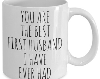 May include: White ceramic coffee mug with black text that reads "You are the best first husband I have ever had."