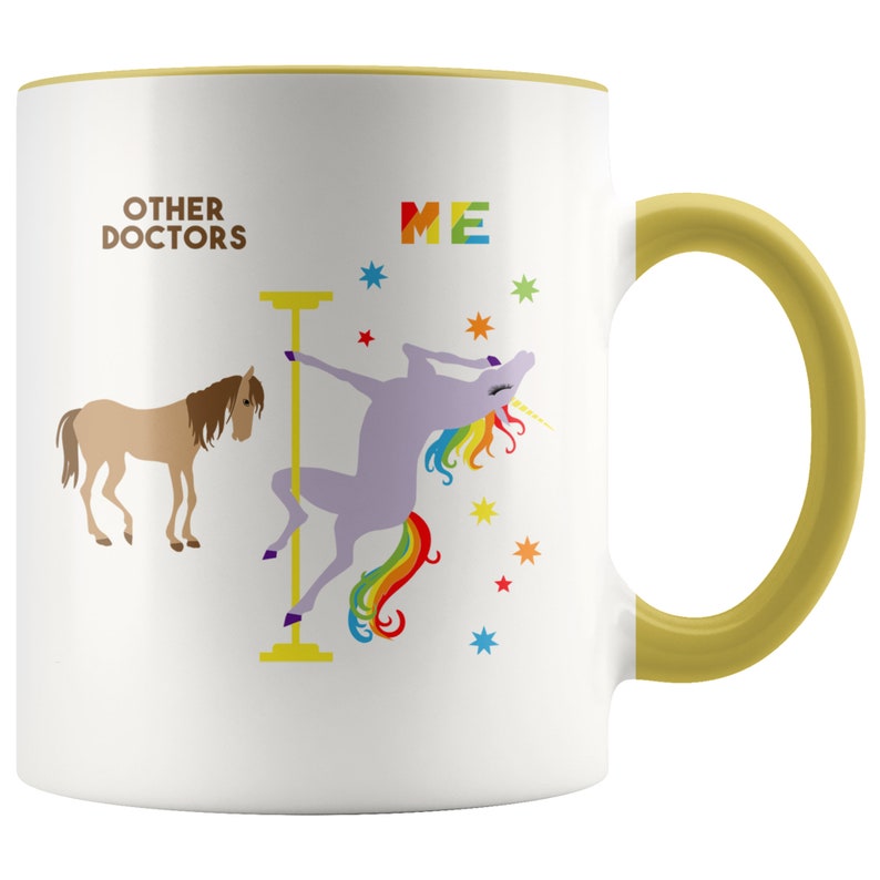 May include: White ceramic mug with a gold rim and handle. The mug features a graphic of a unicorn doing a pole dance with the text "ME" above it. On the left side of the mug is a brown horse with the text "OTHER DOCTORS" above it.