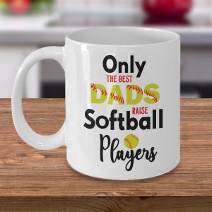 May include: White ceramic coffee mug with a black and yellow graphic that reads "Only the best dads raise softball players".