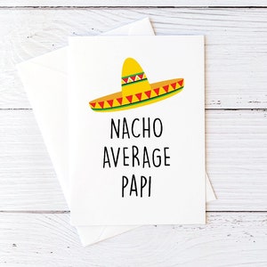 May include: A white card with a yellow sombrero and the text "NACHO AVERAGE PAPI" in black.