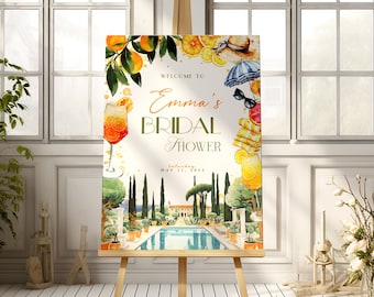 Puede incluir: Un cartel de bienvenida para una despedida de soltera con una ilustración de acuarela de una piscina, palmeras y cítricos. El texto dice "Bienvenido a Emma's Bridal Shower Sábado, 21 de mayo de 2023".
