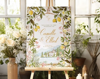 May include: A wedding welcome sign with a floral design featuring lemons, flowers, and a picturesque Italian villa. The sign reads "Welcome to the wedding of Camille & Elliot, Saturday, May 21, 2023."