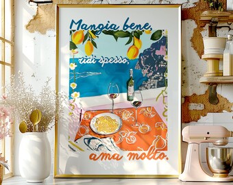 May include: A colorful poster with the text "Mangia bene, ridi spesso, ama molto."  The poster features a table setting with a plate of pasta, two glasses of wine, and lemons. The background is a blue and green landscape with a cityscape.