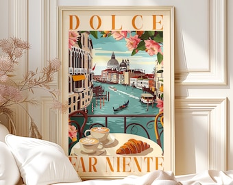 May include: A vintage-style poster with a view of a canal in Venice, Italy. The poster features the text "Dolce Far Niente" and a scene of a gondola on the water. There are two cups of coffee and a croissant on a table in the foreground.