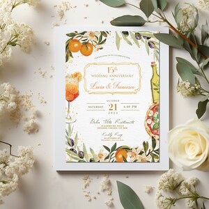 May include: A wedding anniversary invitation with a watercolor illustration of a glass of orange juice, a bottle of olive oil, a pizza, and orange blossoms. The text reads "Please join us to celebrate the 15th Wedding Anniversary of Lucia & Francesco, Saturday October 21, 2023, 6:00 PM, Dolce Vita Ristorante, 14 Albergo Rd, Dolce Ontario, Canada, L5V 1M8, Kindly RSVP by October 14th."