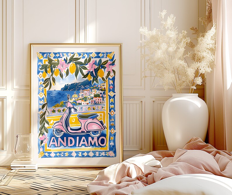 May include: A colorful illustration of a pink scooter with the text "ANDIAMO" in front of a blue and white tiled background. The scooter is in front of a scene of a coastal town with a lemon tree in the foreground.