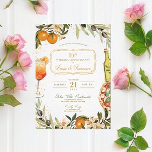May include: A white wedding anniversary invitation with gold accents and a watercolor illustration of a glass of orange juice, a bottle of olive oil, and a pizza slice. The text reads "15th Wedding Anniversary of Lucia & Francesco, October 21, 2023, 6:00 PM, Dolce Vita Ristorante, 18 Alberto Rd, Dolce, Ontario, Canada, L5V 1M8, Kindly RSVP by October 1st to Luna 111- "