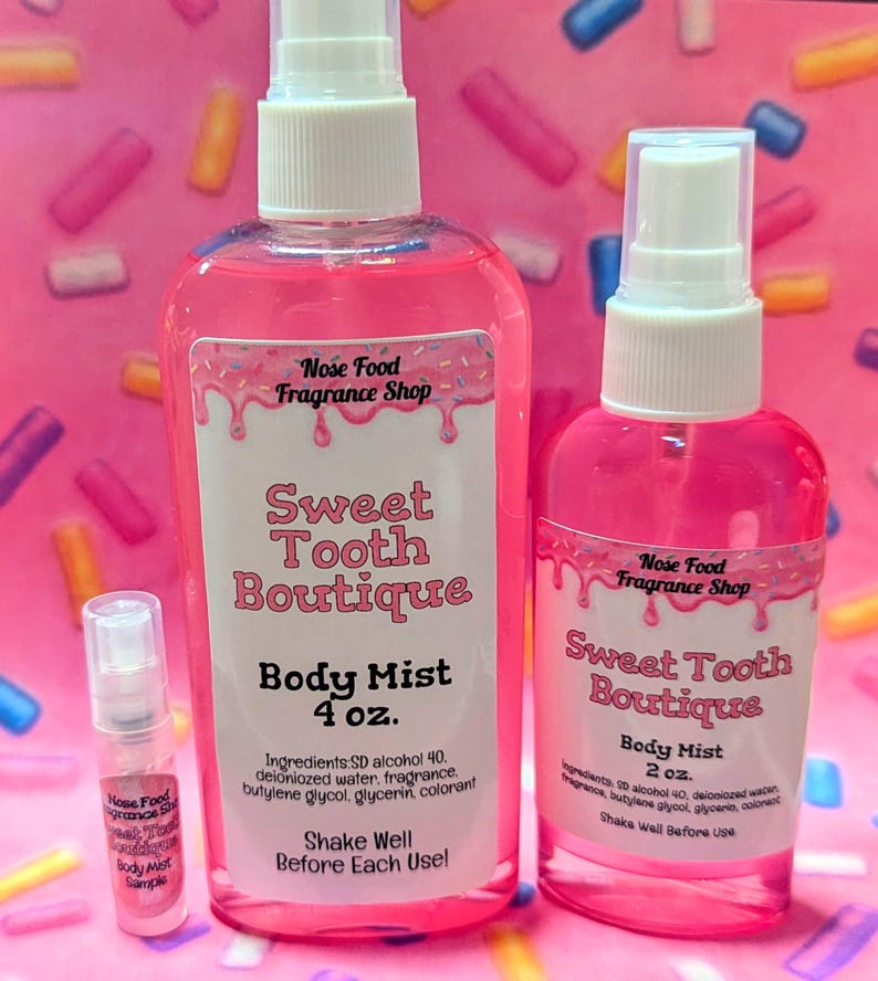 May include: Pink body mists from Nose Food Fragrance Shop. The bottles are labeled "Sweet Tooth Boutique" and come in 4 oz and 2 oz sizes, with a sample size. The labels include ingredients and instructions to shake before use.