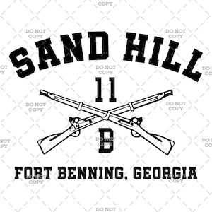 May include: Black and white graphic featuring the text "SAND HILL" above crossed rifles, with "11" and the letter "D" below. The text "FORT BENNING, GEORGIA" is at the bottom. The design is on a white background.