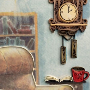 May include: A brown paper craft clock with a white face and black hands, hanging on a blue wall. A brown armchair with a book and a red coffee cup on a table are in the foreground.