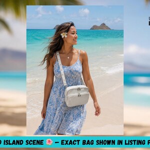 May include: A woman wearing a blue and white dress and a white crossbody bag stands on a beach. The bag has a rectangular shape with a zipper closure. The text "STYLED ISLAND SCENE - EXACT BAG SHOWN IN LISTING PHOTOS" is at the bottom.