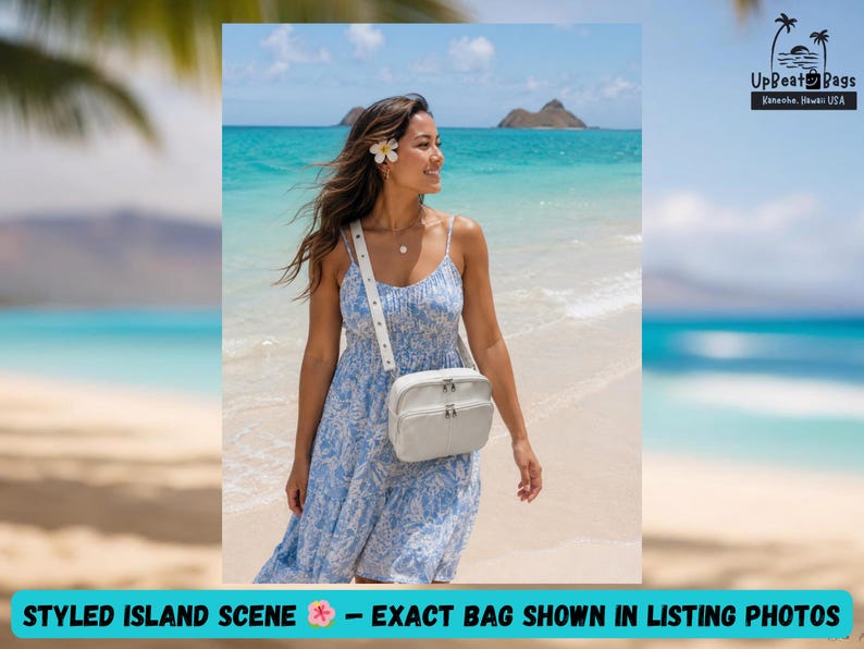 May include: A woman wearing a blue and white dress and a white crossbody bag stands on a beach. The bag has a rectangular shape with a zipper closure. The text "STYLED ISLAND SCENE - EXACT BAG SHOWN IN LISTING PHOTOS" is at the bottom.