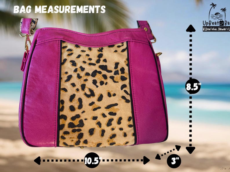 May include: A magenta handbag with a leopard print center panel. The bag measures 10.5 inches wide, 8.5 inches high, and 3 inches deep. The bag has a shoulder strap and gold-colored hardware. The text "BAG MEASUREMENTS" is at the top.