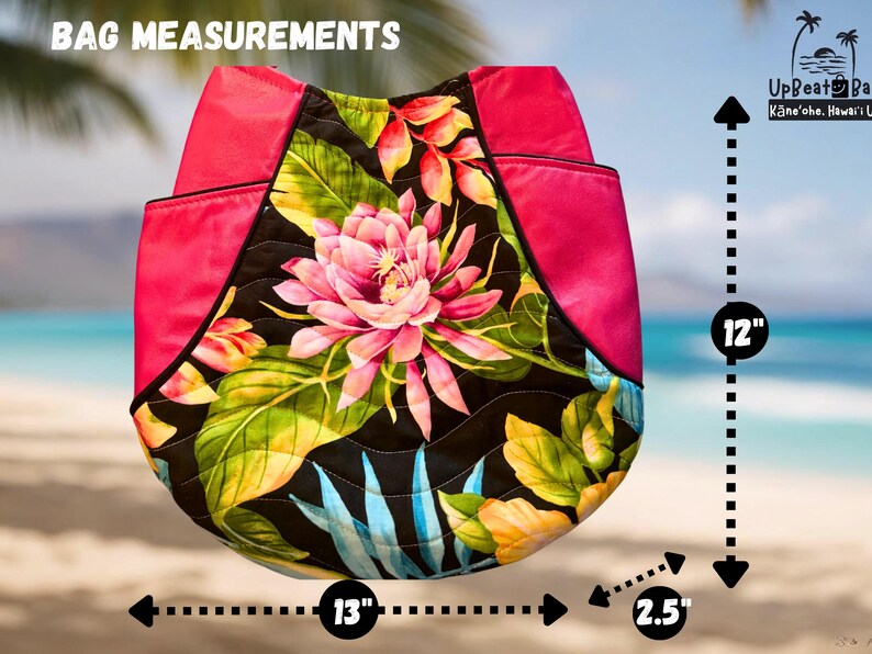 May include: A quilted tote bag with a floral design featuring a pink lotus flower and tropical leaves. The bag has a hot pink top and measures 12 inches high, 13 inches wide, and 2.5 inches deep.