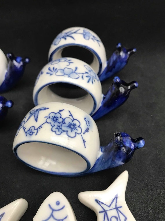 Lot De 6 Ronds De Serviette Escargot Et 6 Pose-couverts Poisson - Porcelaine - Occasion