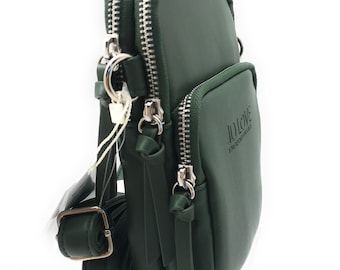 May include: A dark green crossbody bag with two zippered compartments and a small front pocket. The bag has a long, adjustable strap and silver-tone hardware. The text "JD LOVE" is embossed on the front.