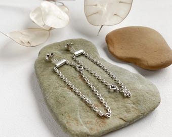 Handmade sterling silver elegant stud earrings with a chain, minimalist style.