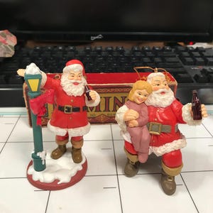 Coca-cola vintage ornament of 2 Santa&#39;s.