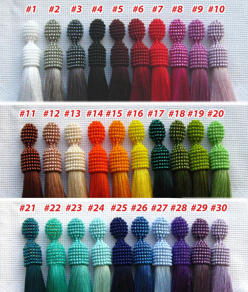 May include: Thirty beaded tassel earrings in various colors, including white, gray, black, red, pink, orange, yellow, green, blue, and purple. The earrings are numbered 1 through 30.