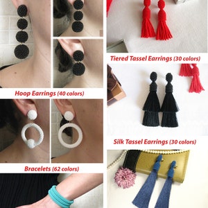 May include: A collage of handmade jewelry, including black beaded earrings, white hoop earrings, and blue tassel earrings. The text "All jewelry in my shop are 100% handmade by me" is at the top of the image.
