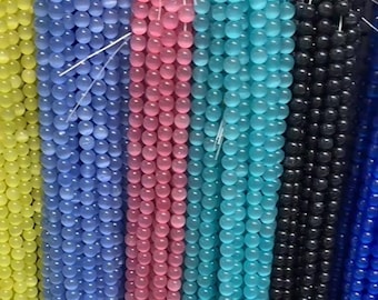 Contas redondas lisas em formato olho de gato nas cores amarelo, vermelho, preto, branco e cinza, de 4 a 16 mm, 15 polegadas.