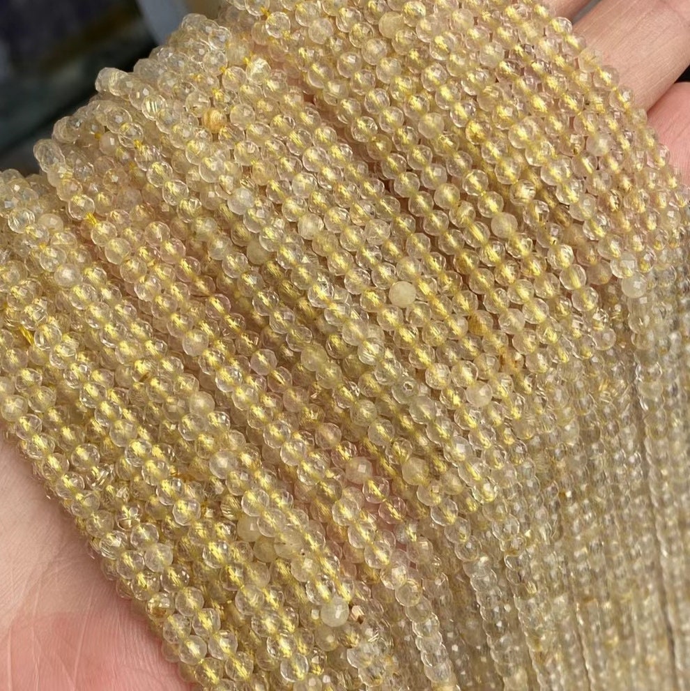 NATURAL RUTILATED QUARTZ ROUND 14mm FACETED BEADS 15" STRAND NATURAL RUTILATED QUARTZ ROUND 14mm FACETED BEADS 15" STRAND