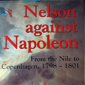 May include: A book cover with a red title "Nelson against Napoleon" and the subtitle "From the Nile to Copenhagen, 1798 - 1801". The cover features a painting of a naval battle with ships and smoke.