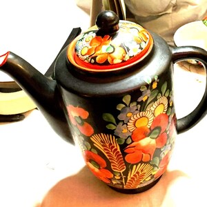 May include: A set of three ceramic mugs with a speckled, matte finish. Each mug features a different color: light blue, cream, and gray. The mugs have a simple, modern design and a comfortable handle.